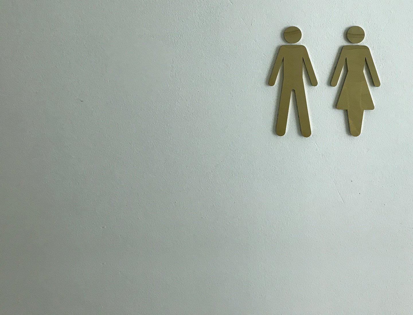 Man and woman symbol on the door of a public toilet.